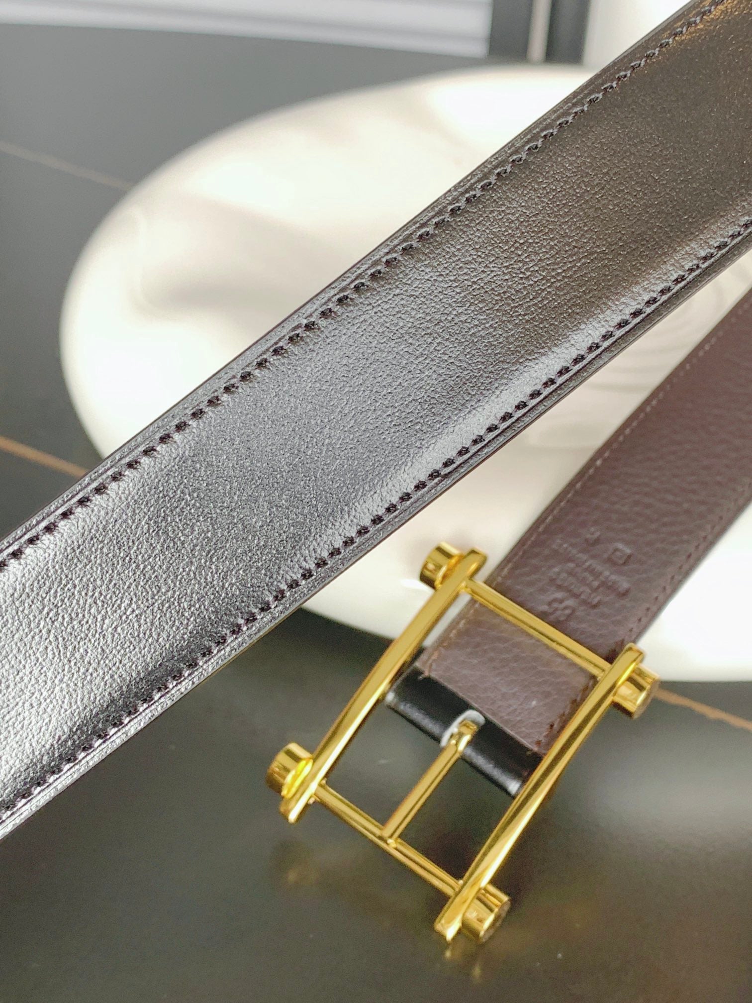 HERMES REVERSIBLE BLACK AND CHESTNUT BROWN LEATHER STRAP 32 MM GOLD HARDWARE